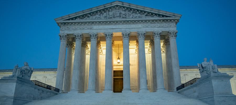 Supreme Court lit from within at twilight